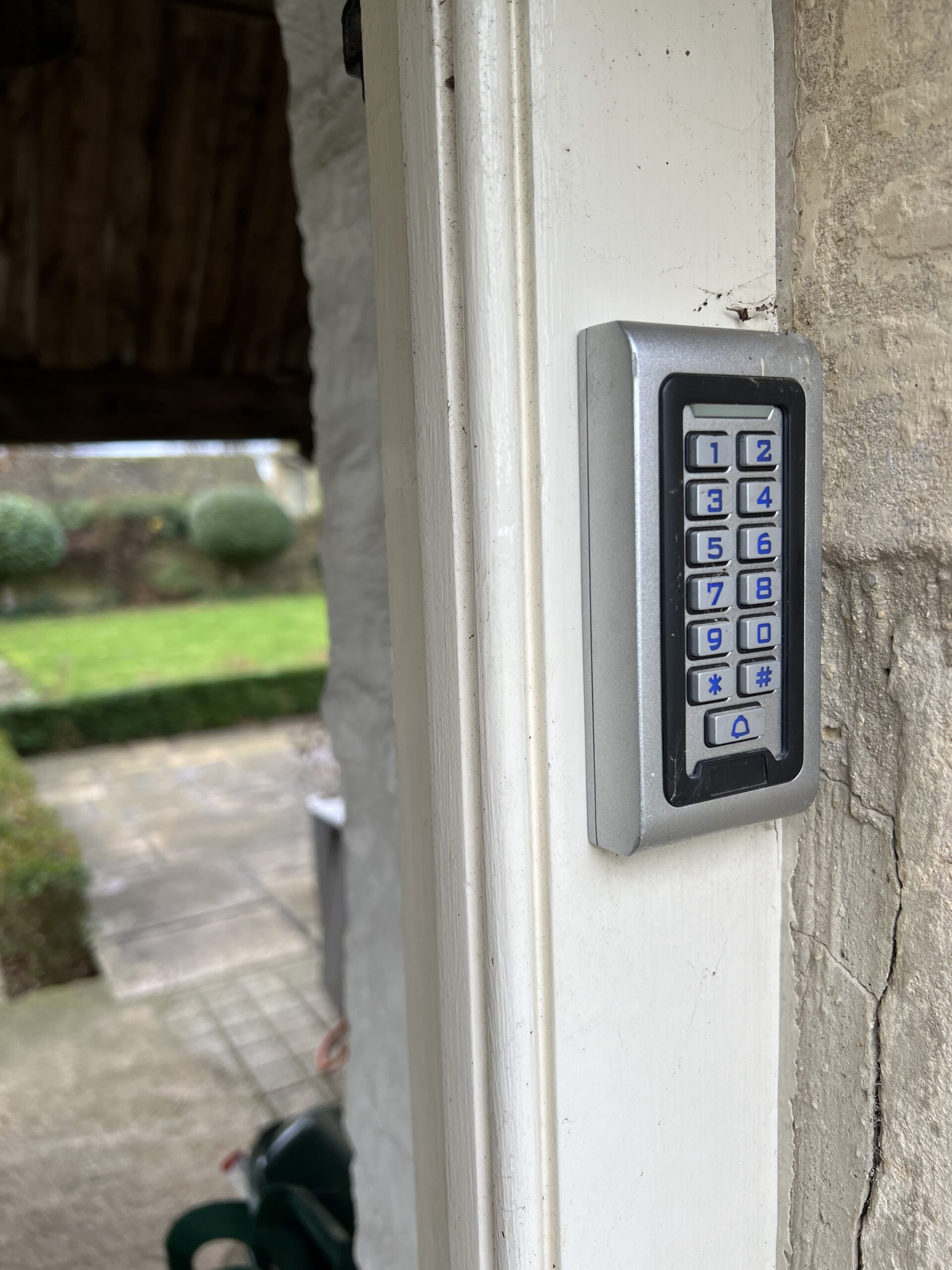 Keypad entry system installed on stone doorframe