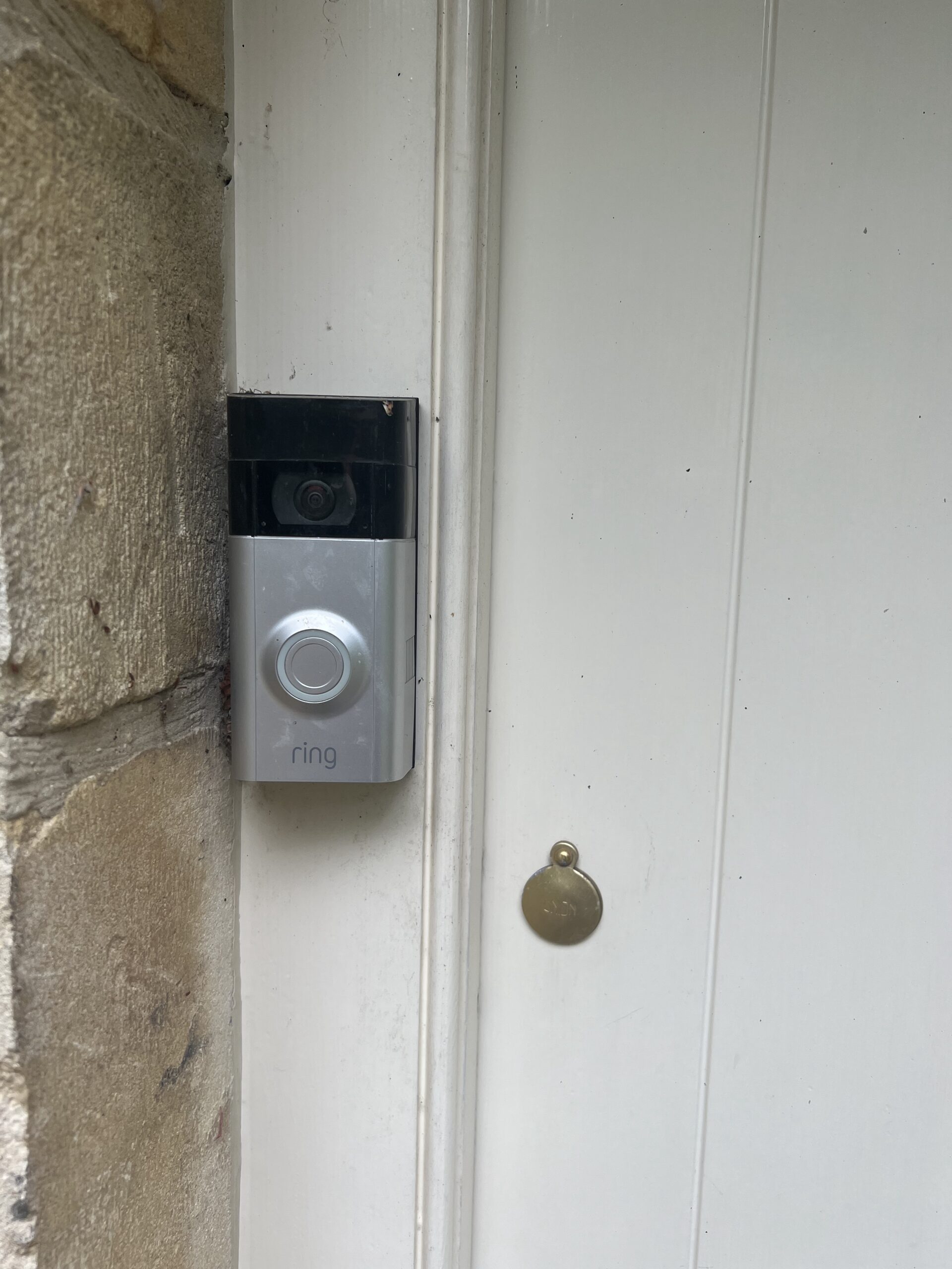 Video doorbell installed on Cotswolds stone doorframe